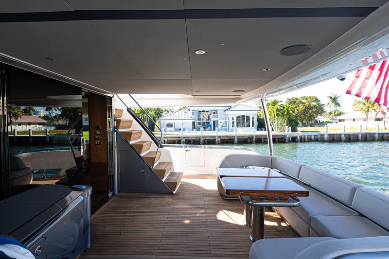 Slide: The Image of Luxurious 2022 Princess Y85 yacht deck with seating, table, and waterfront view. - 43