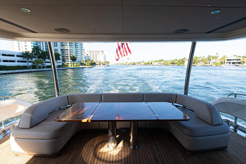 Slide: The Image of Luxurious 2022 Princess Y85 yacht with elegant seating, cruising on a scenic waterway. - 44