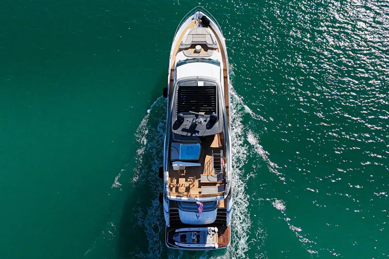 Slide: The Image of Aerial view of 2022 Princess Y85 yacht cruising on turquoise water. - 5