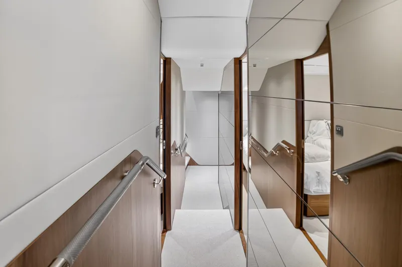 Slide: The Image of Luxurious interior hallway of 2022 Princess Y85 yacht with modern design elements. - 54