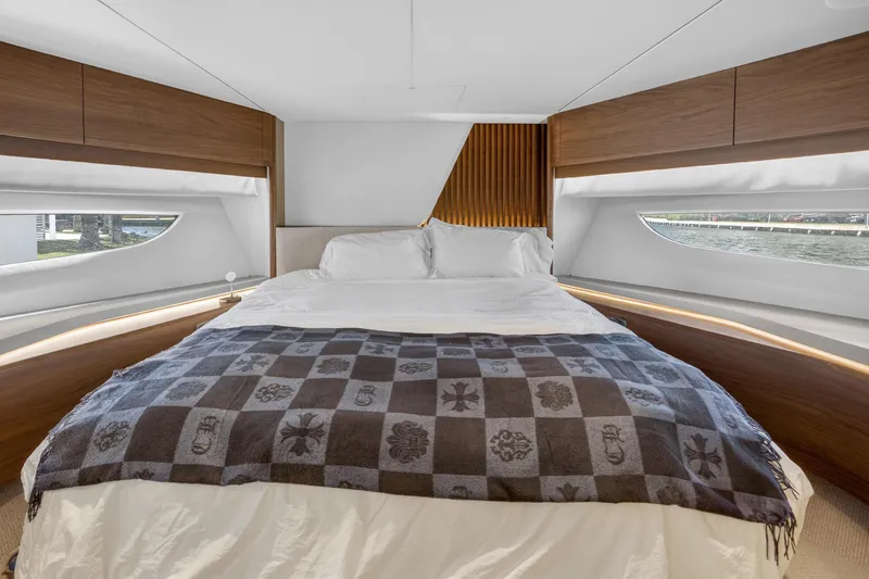 Slide: The Image of Luxurious bedroom interior on 2022 Princess Y85 yacht with elegant wood finishes. - 56