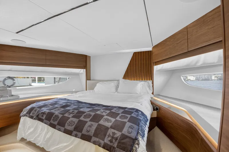 Slide: The Image of Luxurious bedroom interior of 2022 Princess Y85 yacht with modern wood accents. - 58