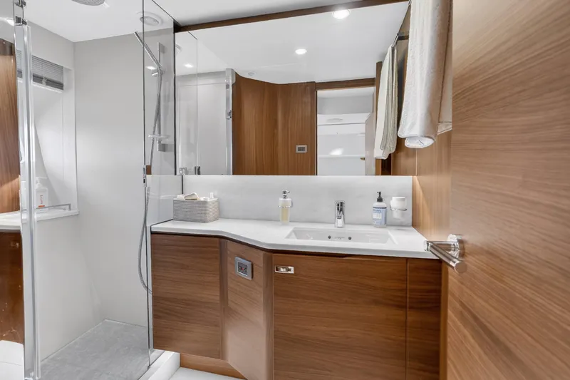 Slide: The Image of Luxurious bathroom interior of 2022 Princess Y85 yacht with modern wood finishes. - 59