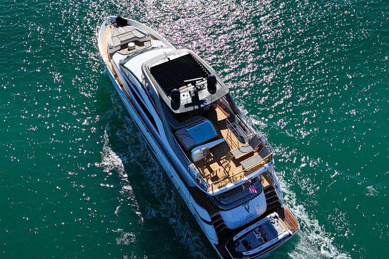 Slide: The Image of Aerial view of 2022 Princess Y85 yacht cruising on sparkling blue water. - 6