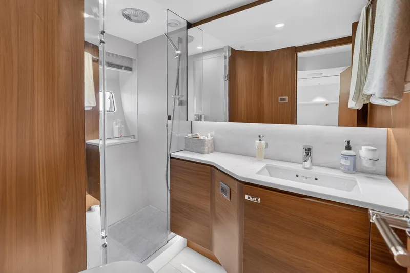 Slide: The Image of Luxurious bathroom in 2022 Princess Y85 yacht with modern fixtures and wooden cabinetry. - 60