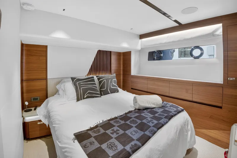 Slide: The Image of Luxurious bedroom interior of 2022 Princess Y85 yacht with modern wood accents. - 61