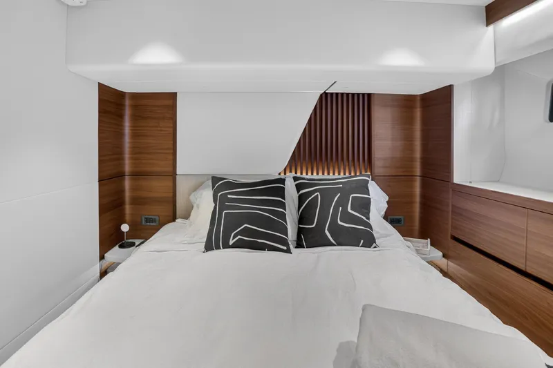 Slide: The Image of Luxurious bedroom interior of 2022 Princess Y85 yacht with modern design and elegant wood accents. - 62