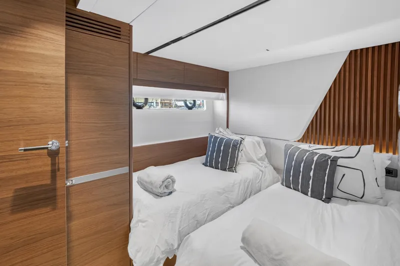 Slide: The Image of Luxurious cabin interior of 2022 Princess Y85 yacht with twin beds and modern decor. - 64