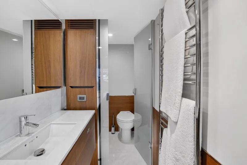 Slide: The Image of Luxurious bathroom in 2022 Princess Y85 yacht with modern fixtures and elegant wood accents. - 66