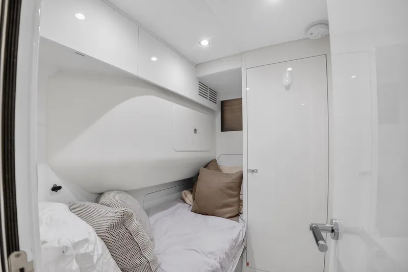 Slide: The Image of Luxurious cabin interior of 2022 Princess Y85 yacht, featuring cozy bedding and modern design. - 69