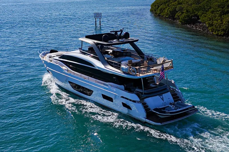 Slide: The Image of Luxurious 2022 Princess Y85 yacht cruising in clear blue waters. - 9