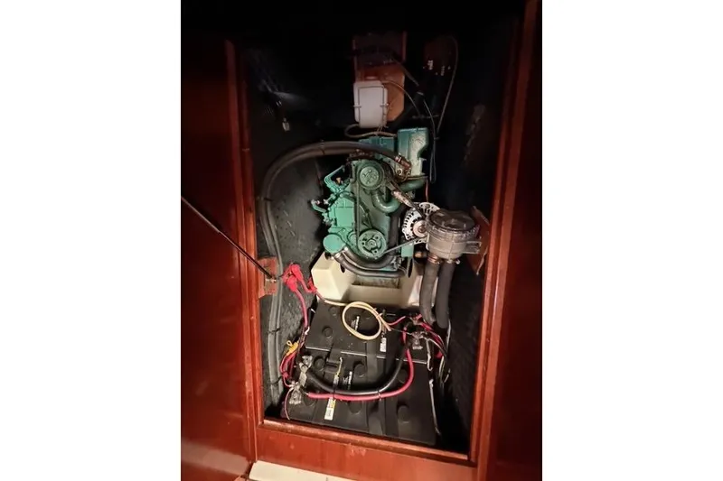 Slide: The Image of Engine compartment of 2005 Beneteau Oceanis Clipper 423 sailboat, showcasing mechanical components. - 14