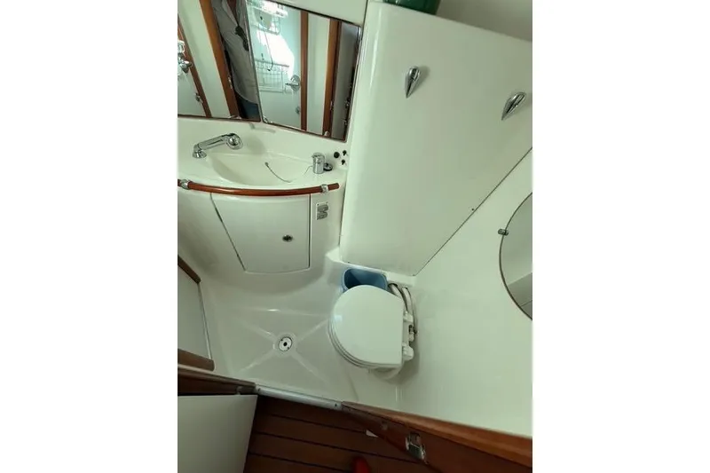 Slide: The Image of Bathroom interior of 2005 Beneteau Oceanis Clipper 423 yacht, featuring sink and toilet. - 17