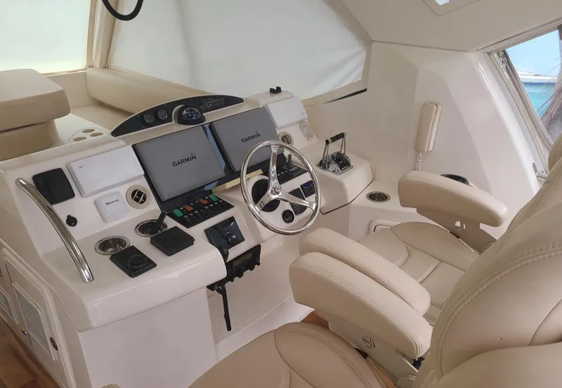 Slide: The Image of 2009 Riviera 47 Enclosed Flybridge Series II helm with Garmin navigation system and leather seating. - 38