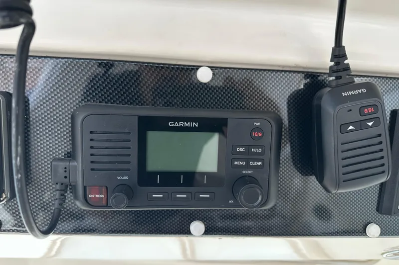 Slide: The Image of Garmin marine radio on 2009 Riviera 47 Enclosed Flybridge Series II dashboard. - 41