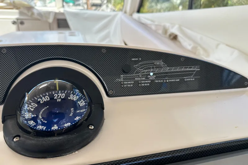 Slide: The Image of Compass and control panel on 2009 Riviera 47 Enclosed Flybridge Series II yacht. - 46