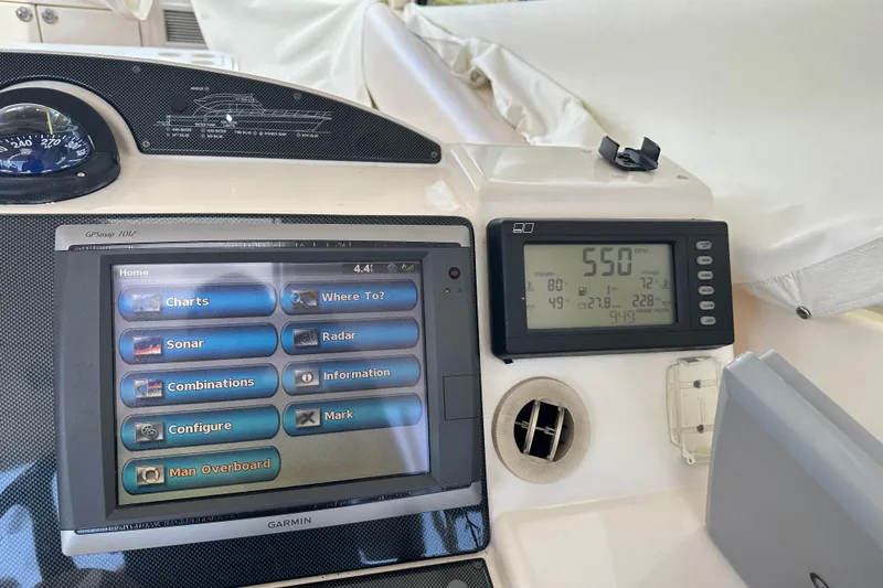 Slide: The Image of Control panel of 2009 Riviera 47 Enclosed Flybridge Series II with navigation and monitoring systems. - 49