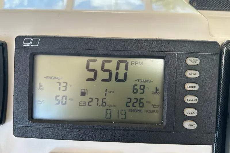 Slide: The Image of Digital display showing engine metrics on a 2009 Riviera 47 Enclosed Flybridge Series II. - 50