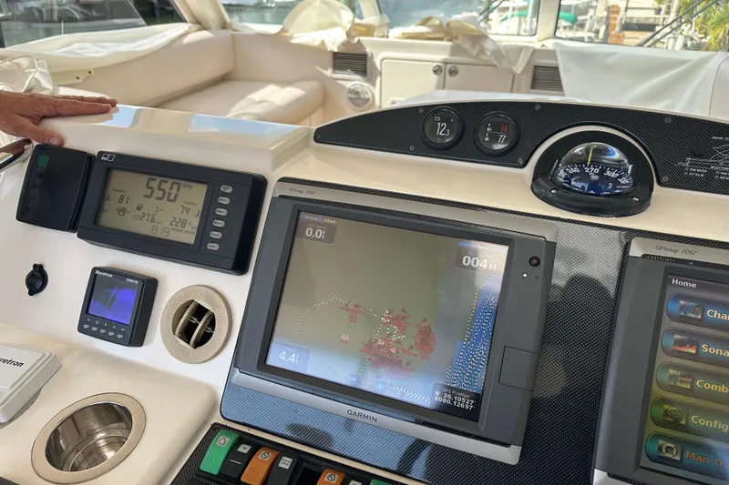 Slide: The Image of Control panel of 2009 Riviera 47 Enclosed Flybridge Series II with navigation and monitoring systems. - 52