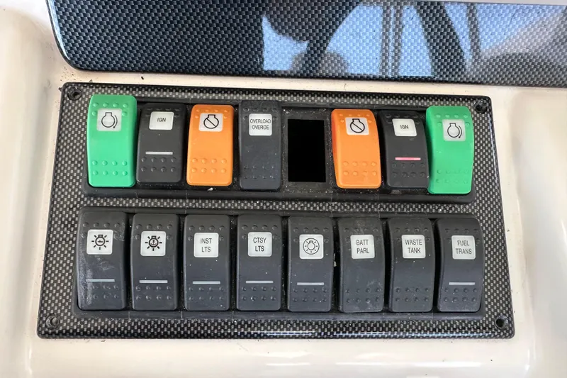 Slide: The Image of Control panel of a 2009 Riviera 47 Enclosed Flybridge Series II yacht. - 53