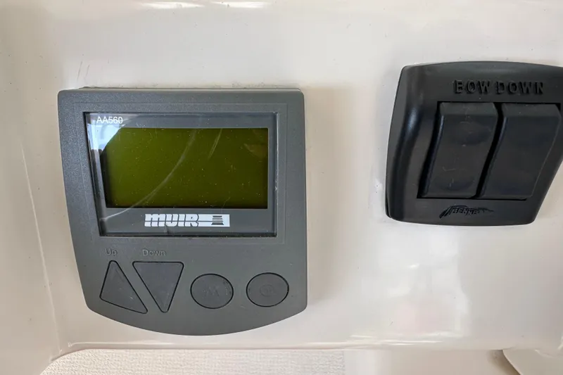 Slide: The Image of Control panel of a 2009 Riviera 47 Enclosed Flybridge Series II yacht. - 56