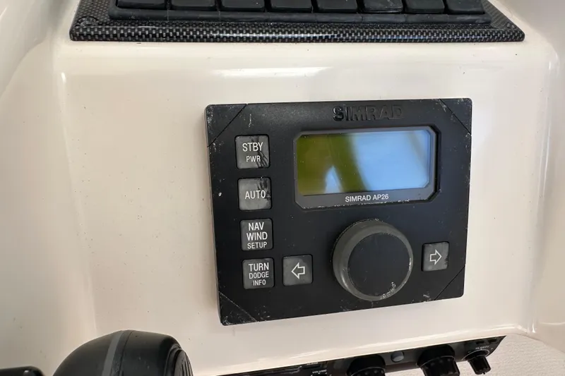 Slide: The Image of Simrad AP26 autopilot control on 2009 Riviera 47 Enclosed Flybridge Series II yacht. - 57