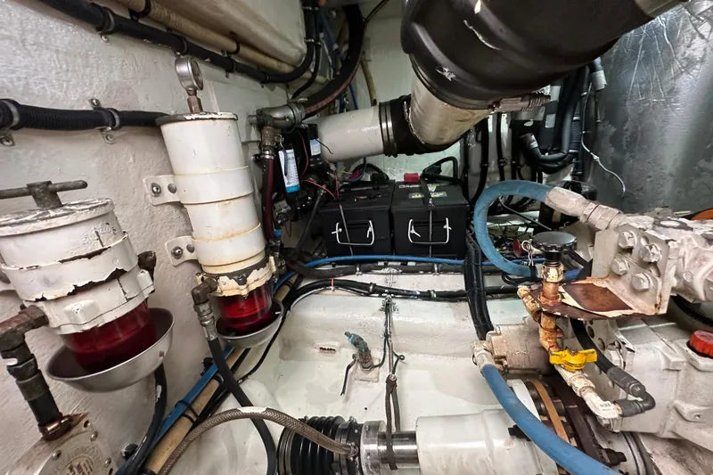 Slide: The Image of Engine room of 2009 Riviera 47 Enclosed Flybridge Series II with visible components and wiring. - 81