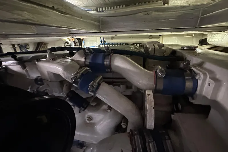 Slide: The Image of Engine compartment of 2009 Riviera 47 Enclosed Flybridge Series II yacht. - 84