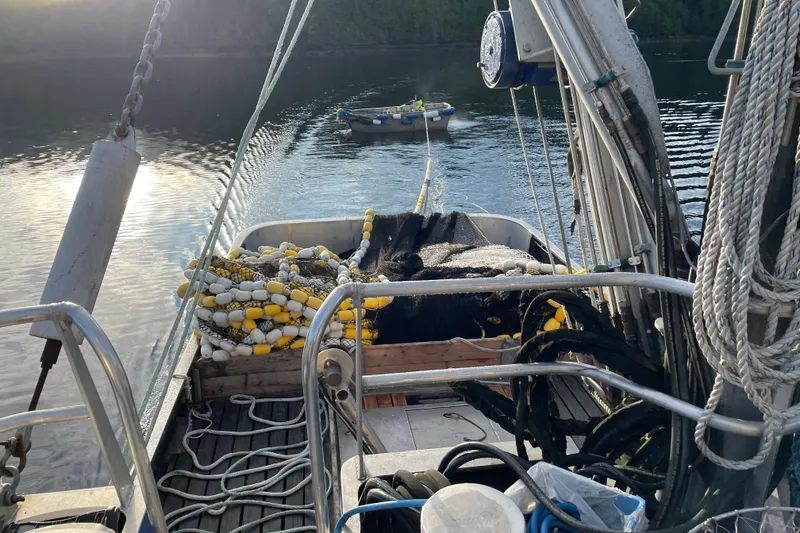 Slide: The Image of Fishing equipment on a 1973 Custom 58’ Steel Marco Seiner, docked on calm water. - 18