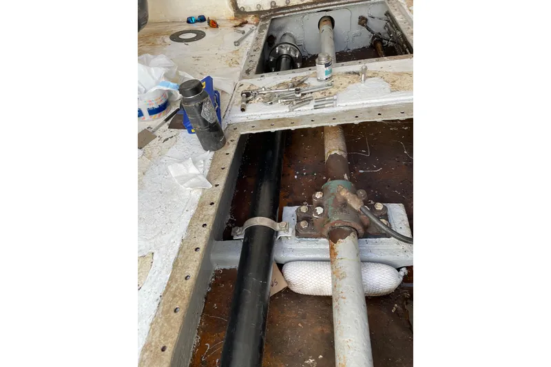 Slide: The Image of Interior view of 1973 Custom 58’ Steel Marco Seiner, showcasing mechanical components and tools. - 21