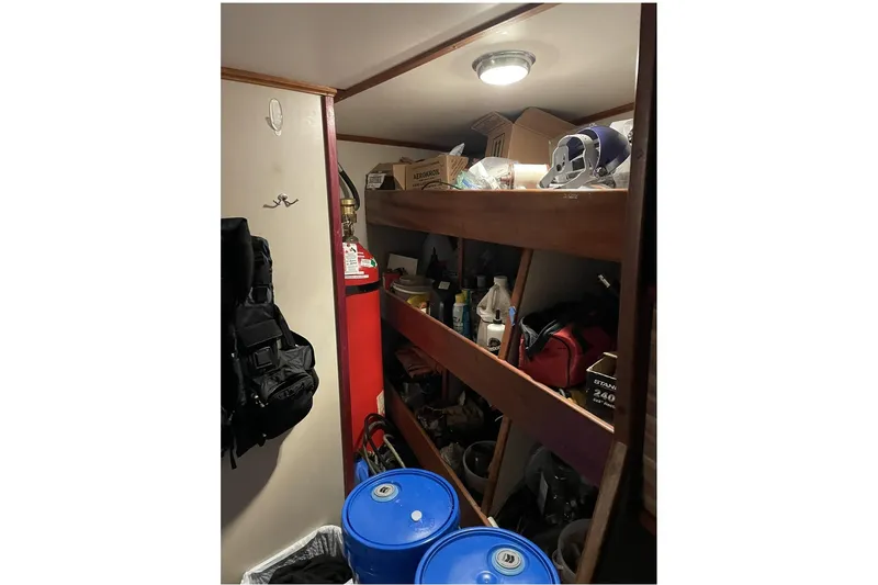 Slide: The Image of Storage area on 1973 Custom 58’ Steel Marco Seiner with shelves and equipment. - 23