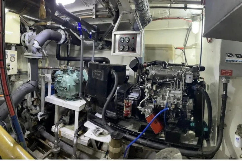 Slide: The Image of Engine room of a 1973 Custom 58’ Steel Marco Seiner with machinery and control panels. - 24