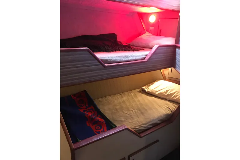 Slide: The Image of Bunk beds in 1973 Custom 58’ Steel Marco Seiner with cozy lighting. - 28
