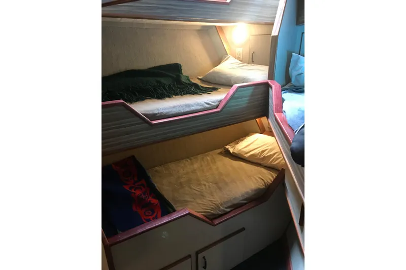 Slide: The Image of Bunk beds in 1973 Custom 58’ Steel Marco Seiner, cozy cabin interior. - 29