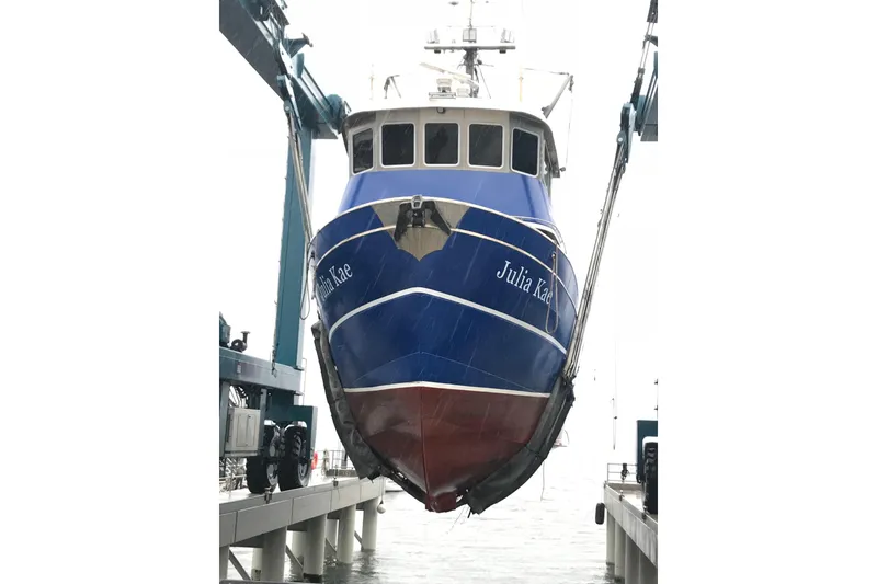 Slide: The Image of 1973 Custom 58’ Steel Marco Seiner boat in dry dock, blue hull visible. - 34