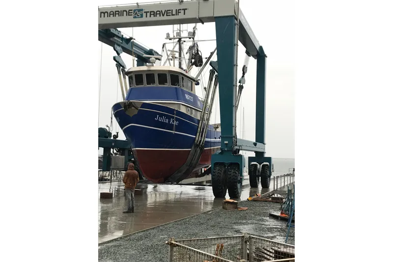 Slide: The Image of 1973 Custom 58’ Steel Marco Seiner on Marine Travelift at dockside. - 35