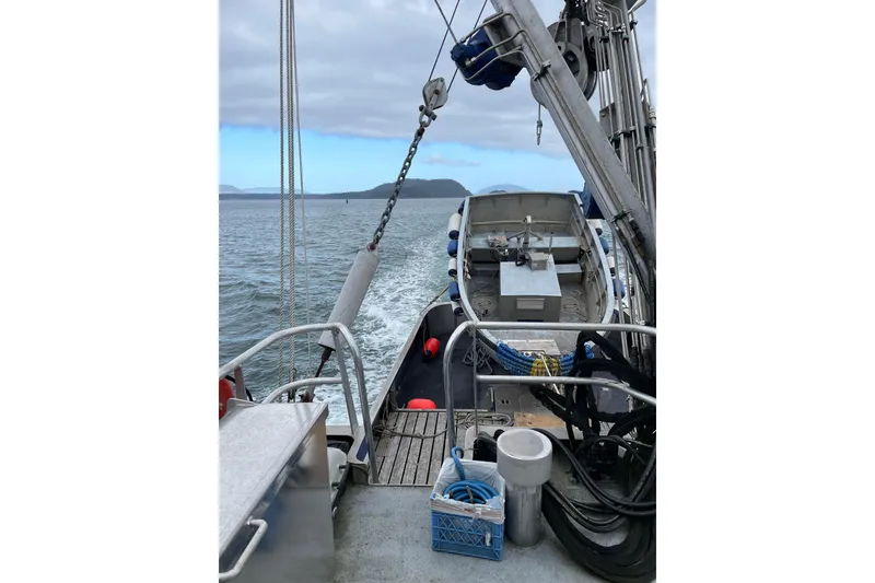 Slide: The Image of 1973 Custom 58’ Steel Marco Seiner on open water, showcasing deck and equipment. - 39