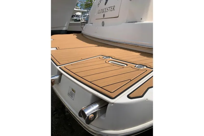 Slide: The Image of 2006 Rinker Fiesta Vee 300 boat with teak swim platform, docked in Gloucester. - 22