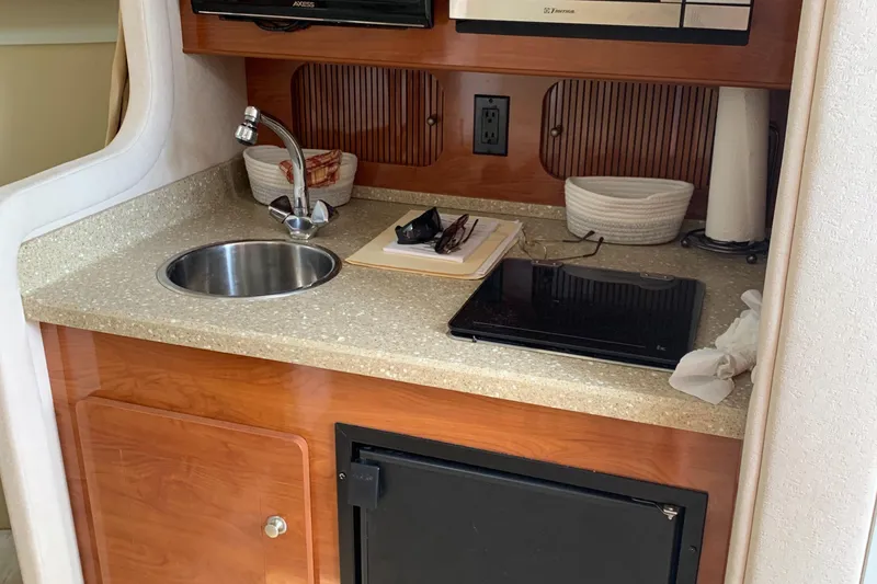 Slide: The Image of Galley in a 2006 Rinker Fiesta Vee 300 yacht. - 10