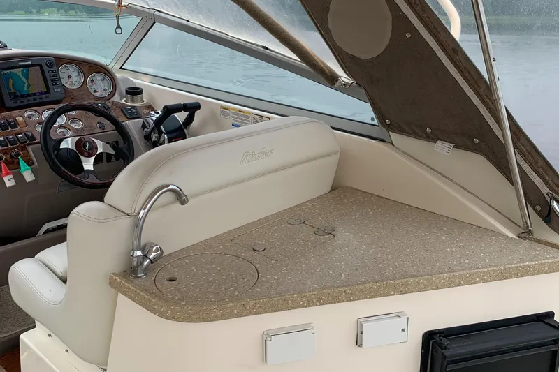 Slide: The Image of Interior of a 2006 Rinker Fiesta Vee 300 boat with helm console. - 14
