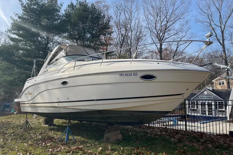 Slide: The Image of 2006 Rinker Fiesta Vee 300 boat propped up outdoors. - 20