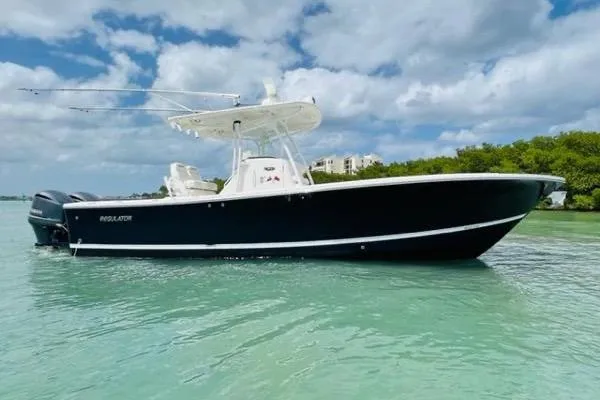 The Image of 2014 Regulator 28 boat on calm water. - 1