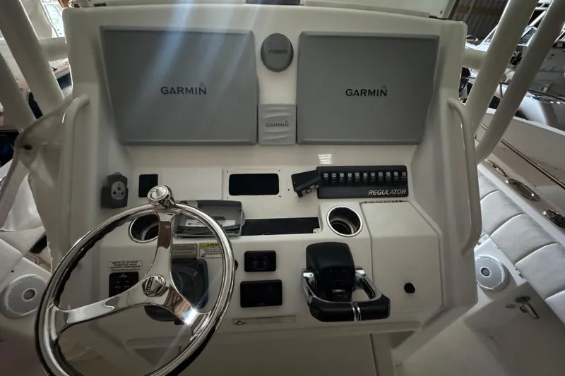 Slide: The Image of 2014 Regulator 28 boat helm with Garmin displays. - 12