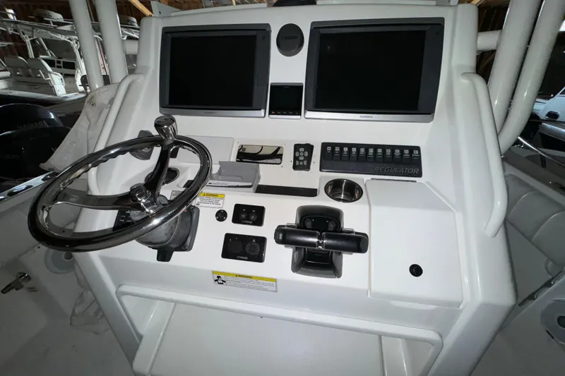 Slide: The Image of Control console of a 2014 Regulator 28 boat. - 14