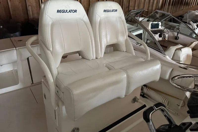 Slide: The Image of Regulator 28 boat seats, white leather, year 2014. - 17