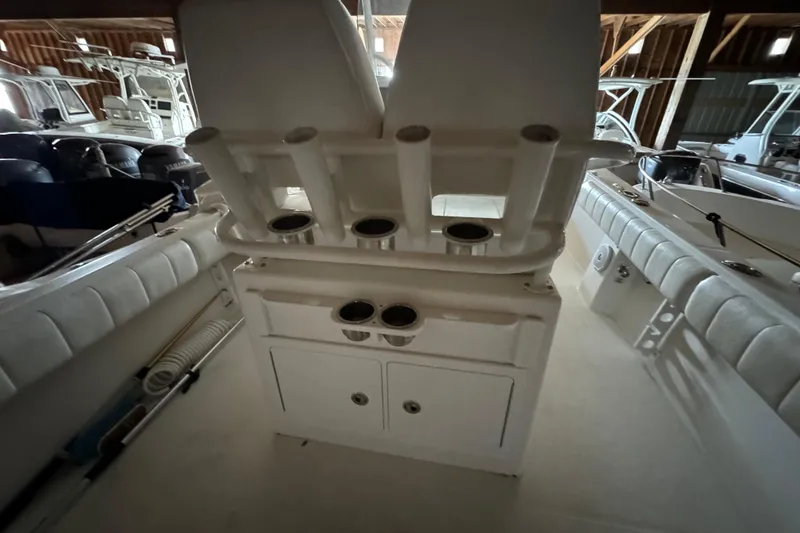 Slide: The Image of Interior view of a 2014 Regulator 28 boat with fishing rod holders. - 18