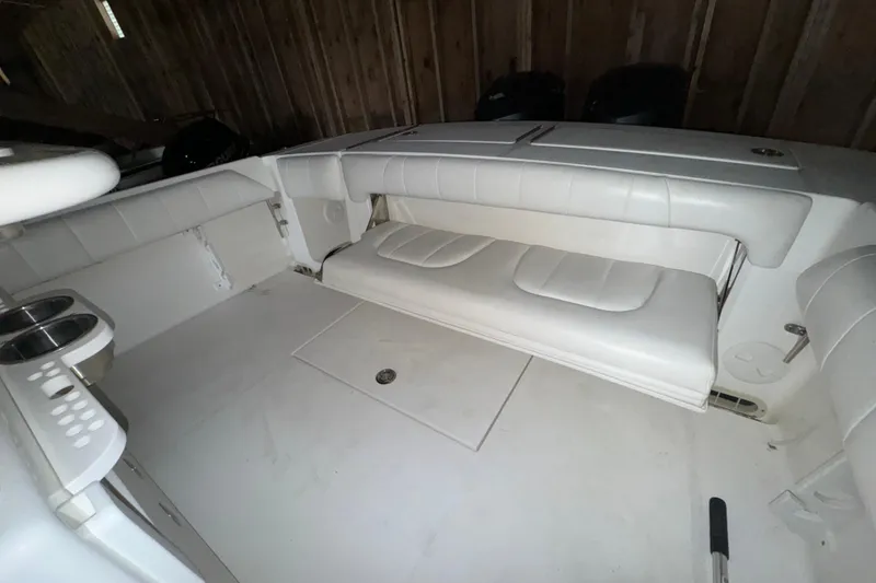 Slide: The Image of Interior of a 2014 Regulator 28 boat with white seating. - 20