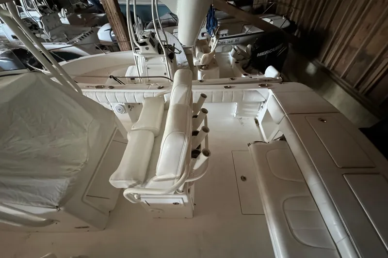 Slide: The Image of Interior view of a 2014 Regulator 28 boat with white upholstery. - 21