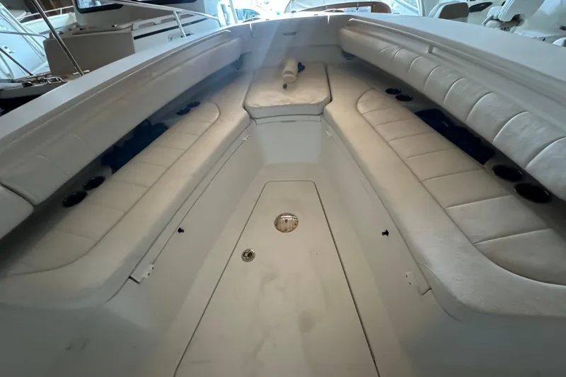 Slide: The Image of Interior view of a 2014 Regulator 28 boat with cushioned seating. - 6