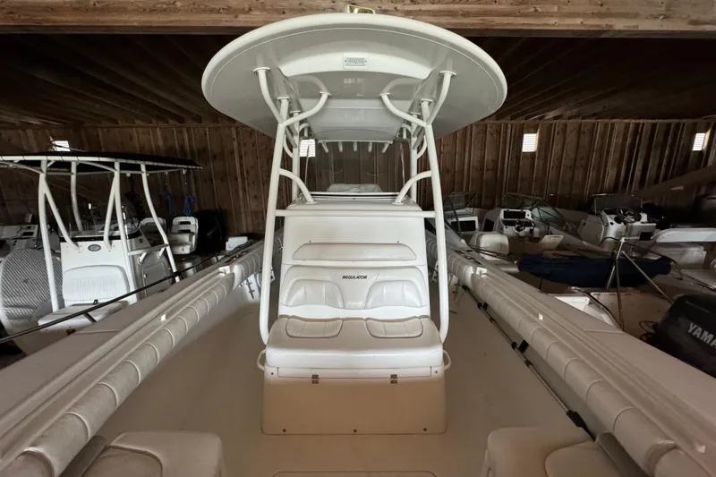 Slide: The Image of Interior view of a 2014 Regulator 28 boat in a barn. - 9